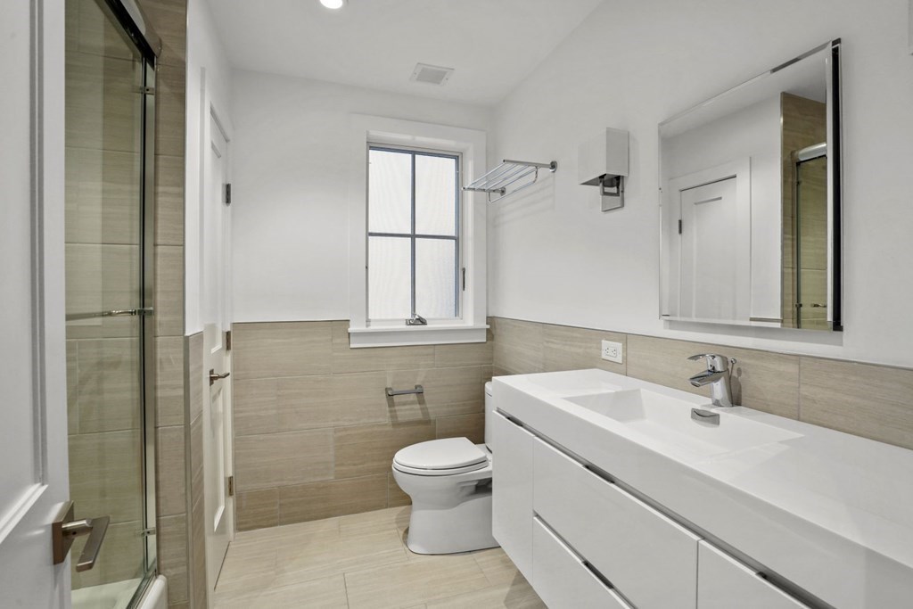 14 Hardwick Street, Unit 1 Cambridge, MA 02141 - Photo 15 of 31 a bathroom with a sink toilet and shower