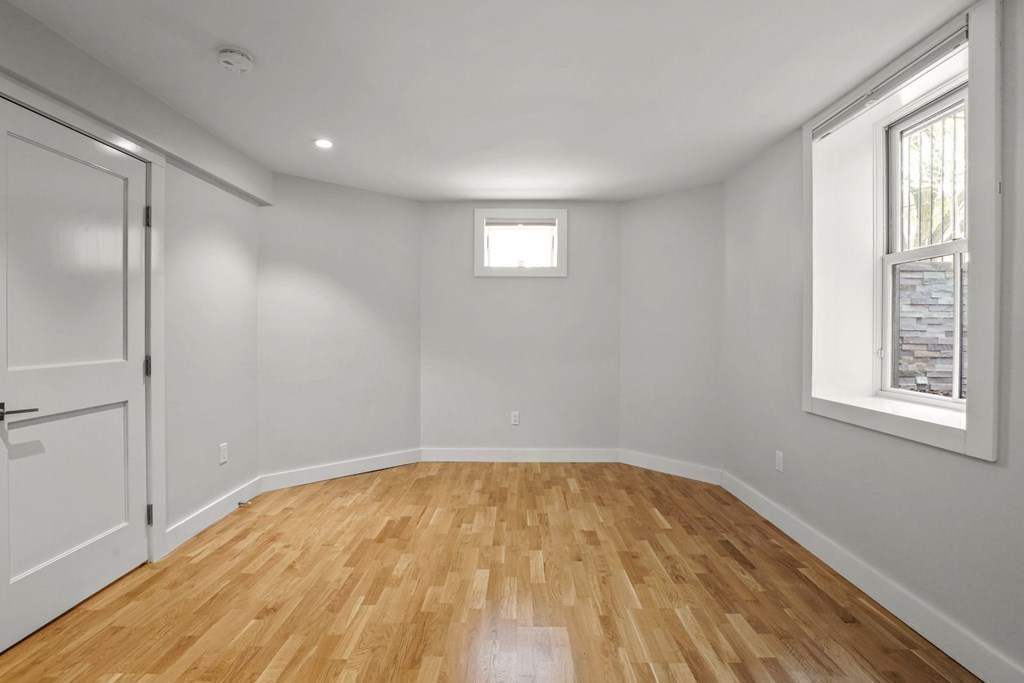 14 Hardwick Street, Unit 1 Cambridge, MA 02141 - Photo 18 of 31 a view of empty room with wooden floor and fan