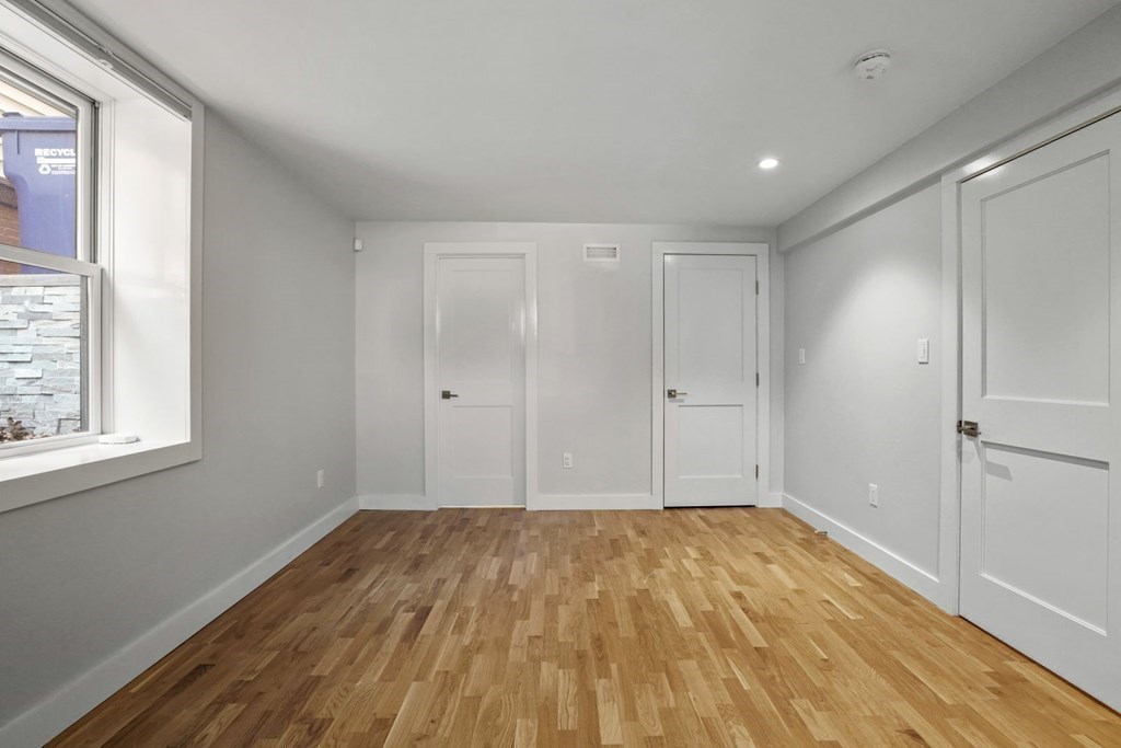14 Hardwick Street, Unit 1 Cambridge, MA 02141 - Photo 20 of 31 a view of room with window and wooden floor
