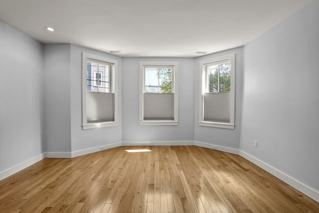14 Hardwick Street, Unit 1 Cambridge, MA 02141 - Photo 25 of 31 a view of empty room with wooden floor and fan