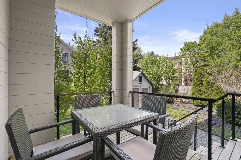 14 Hardwick Street, Unit 1 Cambridge, MA 02141 - Photo 27 of 31 a view of a balcony with table and chairs
