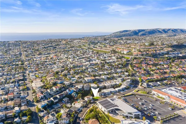 an aerial view of residential building with parking space