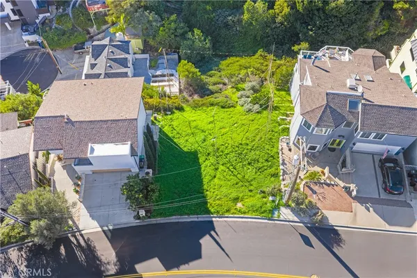 an aerial view of a house with a garden