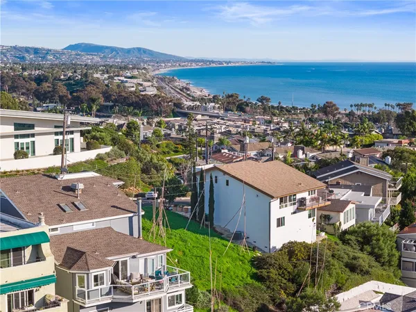 a view of city with ocean
