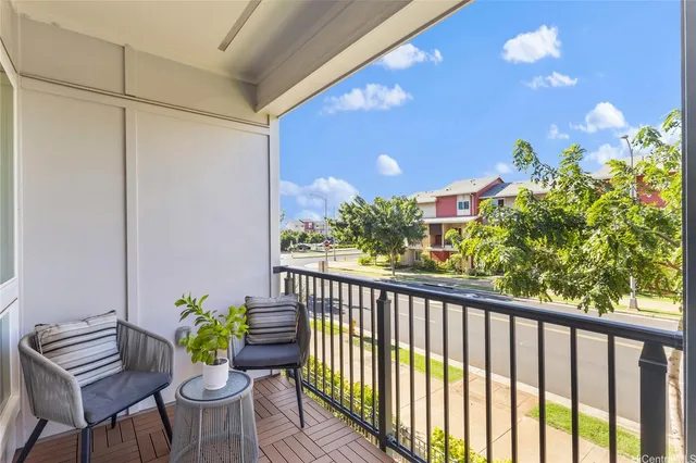 a view of a chairs and table in a balcony