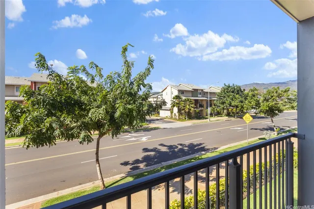 a view of a street from a balcony