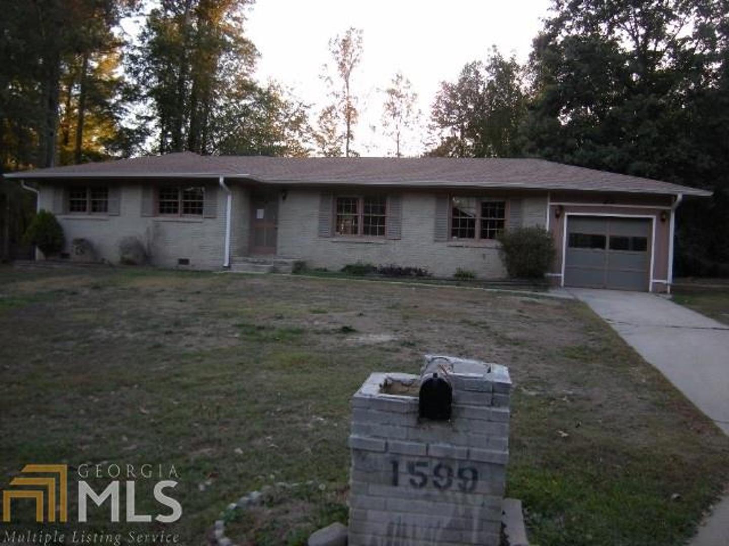1599 Plover Road Hampton, GA 30228 - Photo 1 of 1 a front view of a house with a yard