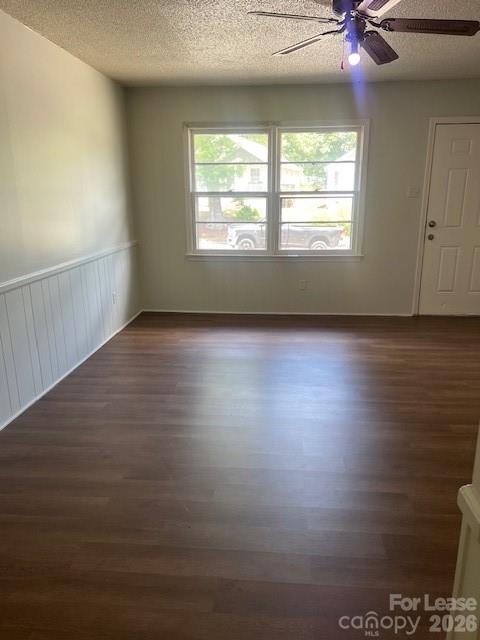 318 Salisbury Road Statesville, NC 28677 - Photo 2 of 6 an empty room with wooden floor and windows