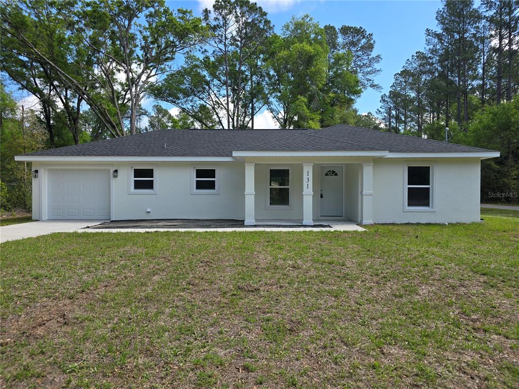 131 Fisher Road Ocklawaha, FL 32179 - Photo 1 of 42 a backyard of a house with lots of green space