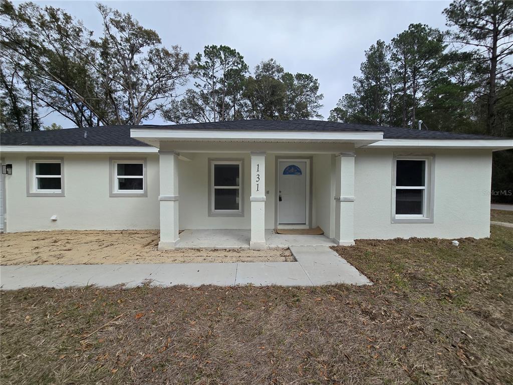 131 Fisher Road Ocklawaha, FL 32179 - Photo 12 of 41 a view of a house with a outdoor space