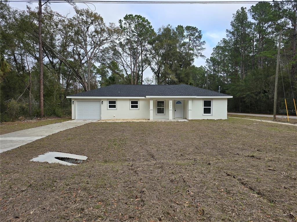 131 Fisher Road Ocklawaha, FL 32179 - Photo 2 of 41 front view of house with a yard