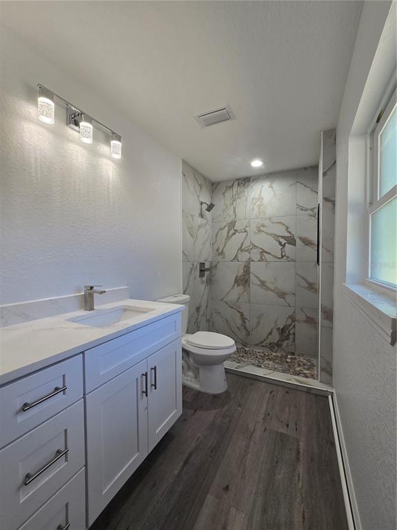 131 Fisher Road Ocklawaha, FL 32179 - Photo 21 of 41 a bathroom with a double vanity sink toilet and shower