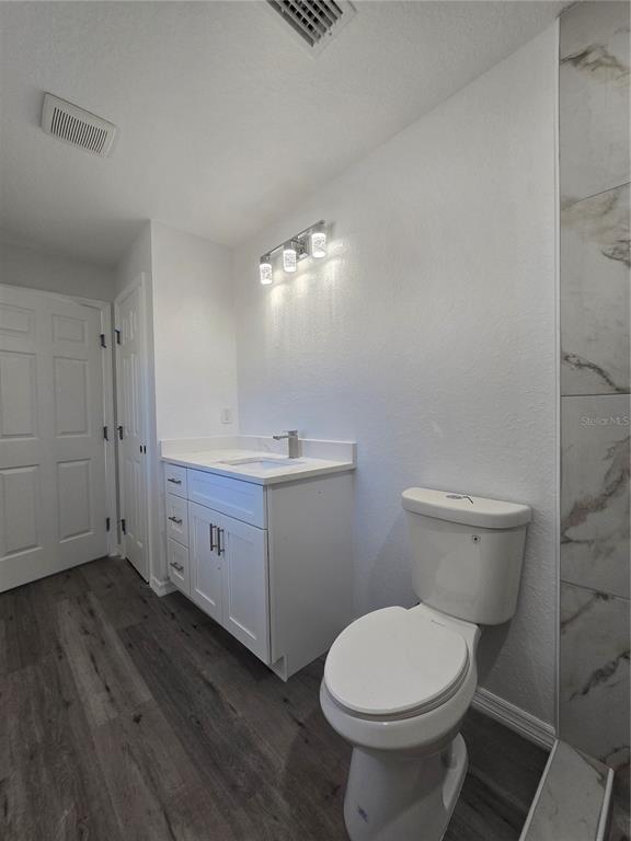 131 Fisher Road Ocklawaha, FL 32179 - Photo 23 of 41 a bathroom with a toilet sink and mirror
