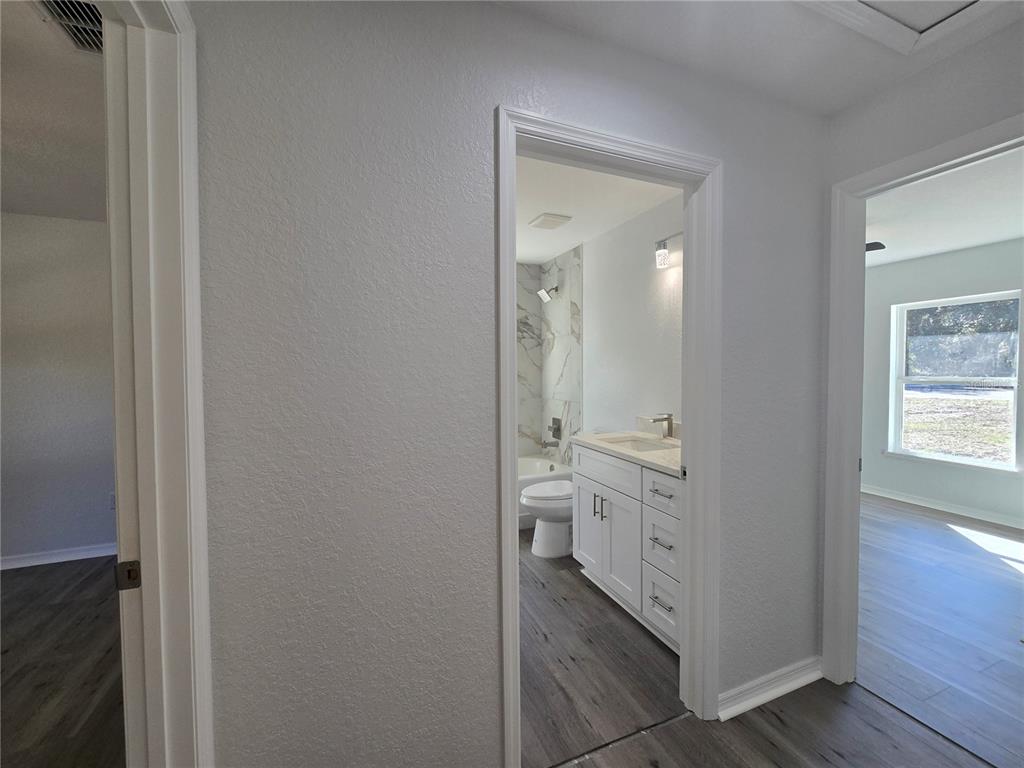 131 Fisher Road Ocklawaha, FL 32179 - Photo 29 of 41 a bathroom with a double vanity sink and a mirror