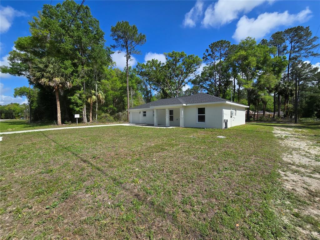 131 Fisher Road Ocklawaha, FL 32179 - Photo 3 of 42 a house view with a outdoor space