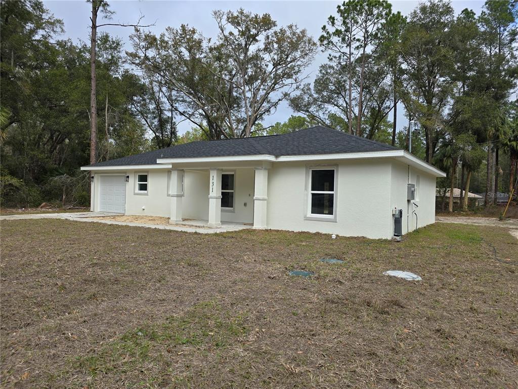 131 Fisher Road Ocklawaha, FL 32179 - Photo 3 of 41 a view of a house with a yard
