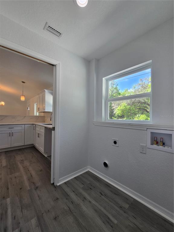131 Fisher Road Ocklawaha, FL 32179 - Photo 40 of 42 a view of an empty room with wooden floor and a window