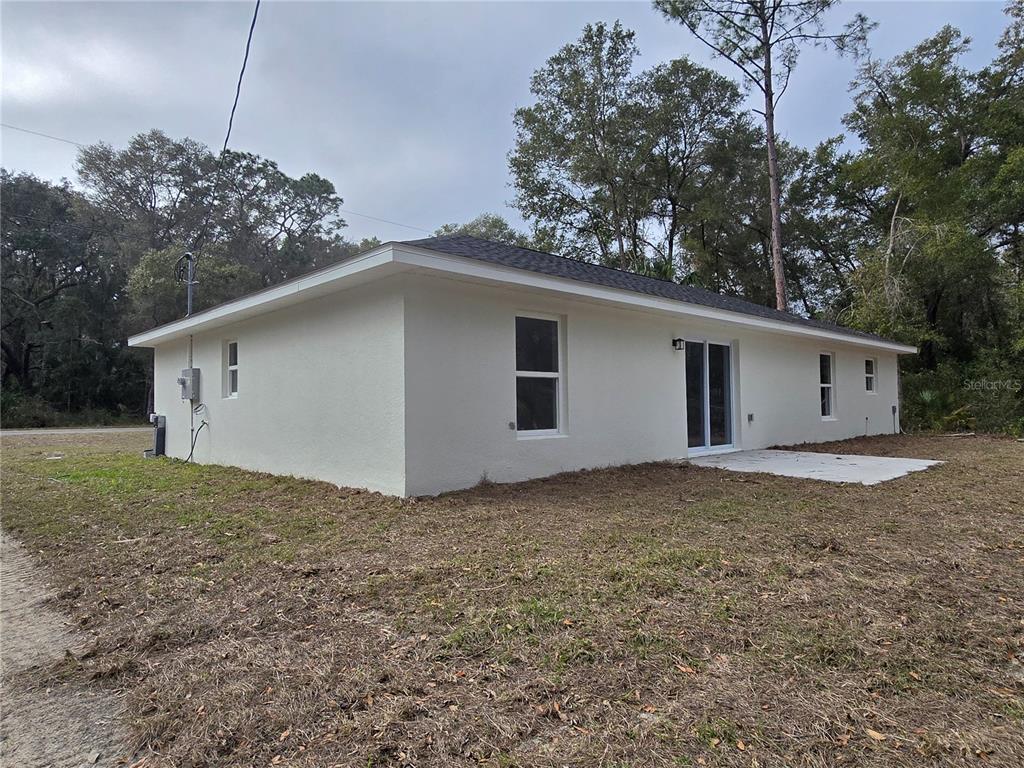 131 Fisher Road Ocklawaha, FL 32179 - Photo 4 of 41 a house view with a backyard space