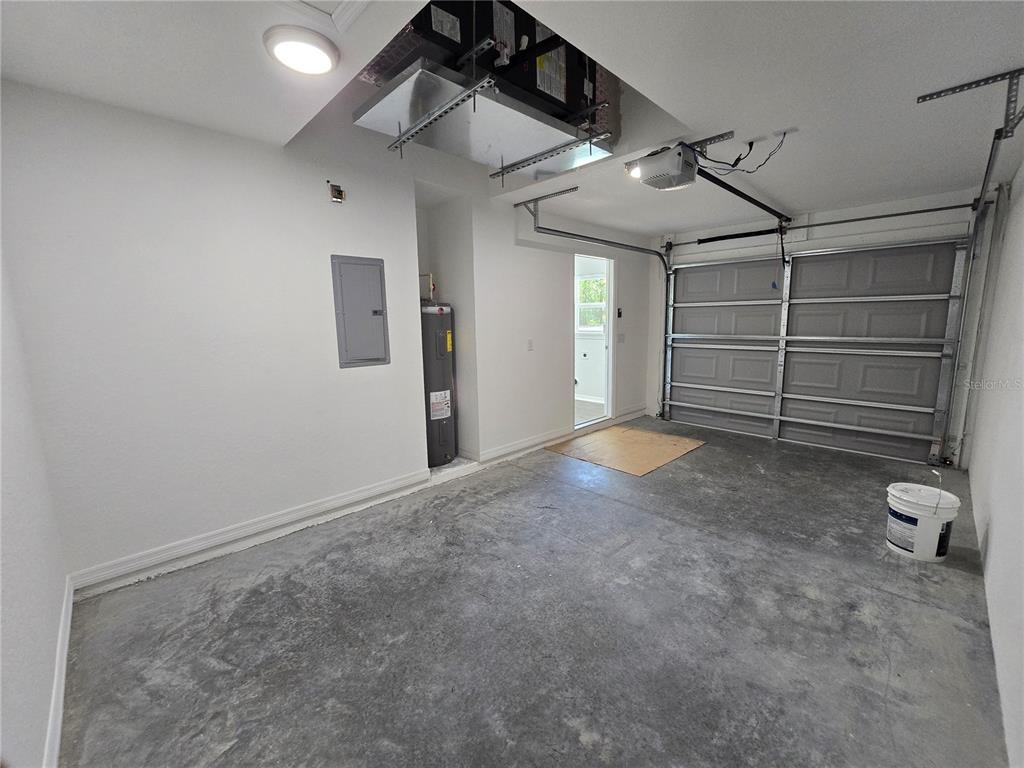 131 Fisher Road Ocklawaha, FL 32179 - Photo 42 of 42 a view of an empty room with racks on the wall