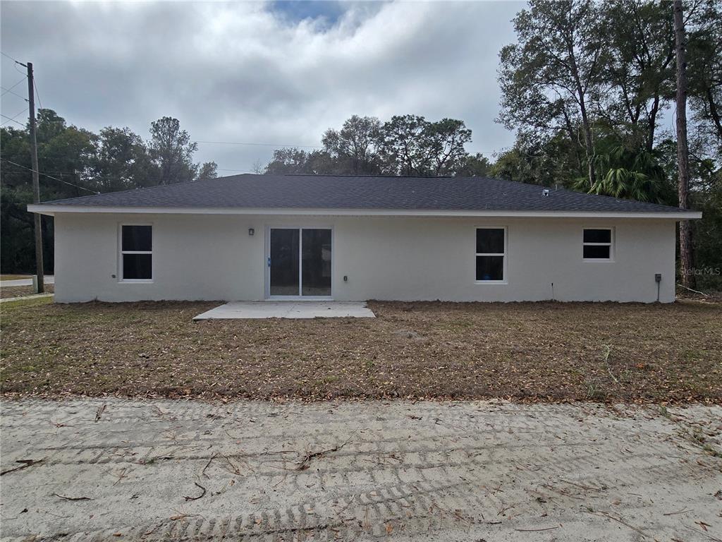 131 Fisher Road Ocklawaha, FL 32179 - Photo 5 of 41 a house view with a backyard space