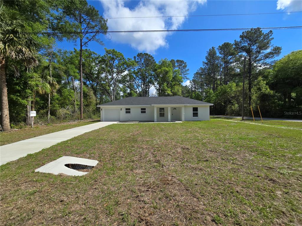 131 Fisher Road Ocklawaha, FL 32179 - Photo 8 of 42 a view of a house with a yard