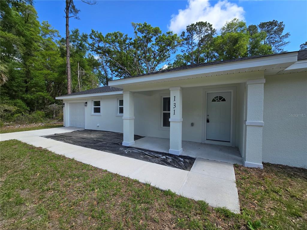 131 Fisher Road Ocklawaha, FL 32179 - Photo 10 of 42 front view of a house with a yard