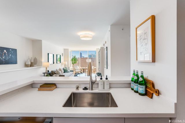 a kitchen with a sink and a window