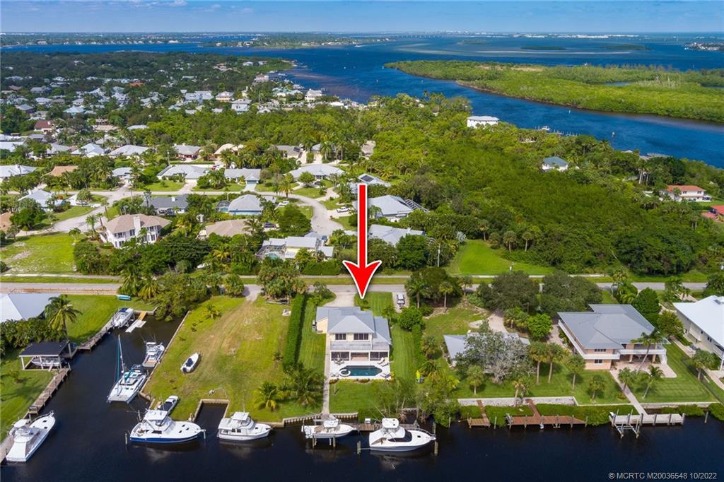 5854 Southeast Horseshoe Point Road Stuart, FL 34997 - Photo 11 of 56 an aerial view of residential houses with outdoor space