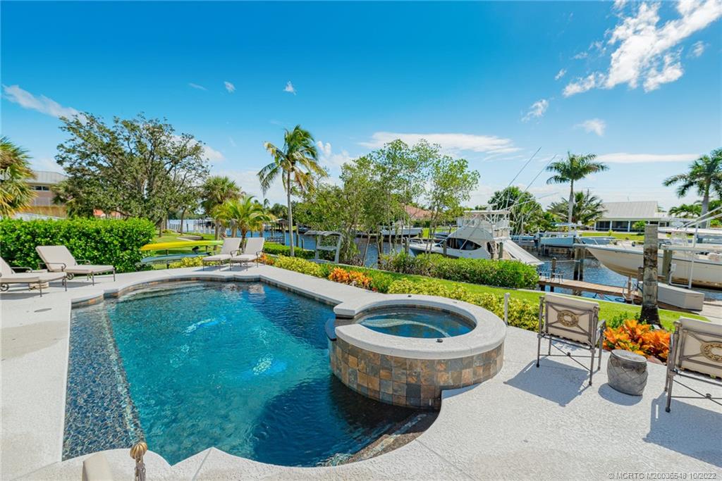 5854 Southeast Horseshoe Point Road Stuart, FL 34997 - Photo 44 of 56 a view of swimming pool with outdoor seating