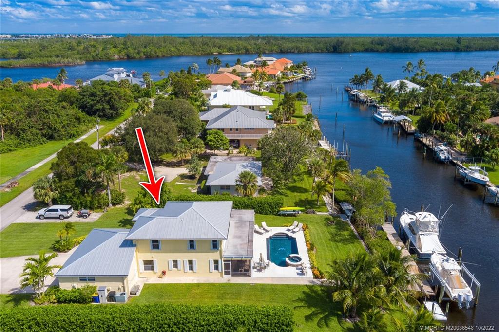 5854 Southeast Horseshoe Point Road Stuart, FL 34997 - Photo 5 of 56 an aerial view of a house with a lake view