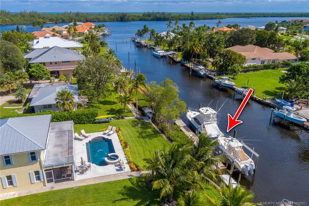 5854 Southeast Horseshoe Point Road Stuart, FL 34997 - Photo 8 of 56 an aerial view of a house with a lake view
