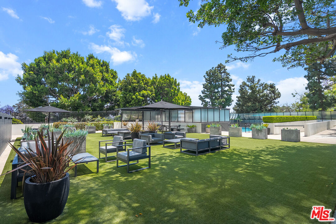 2222 Avenue Of The Stars, Unit 1404 Los Angeles, CA 90067 - Photo 11 of 12 a view of a chair and table in the garden