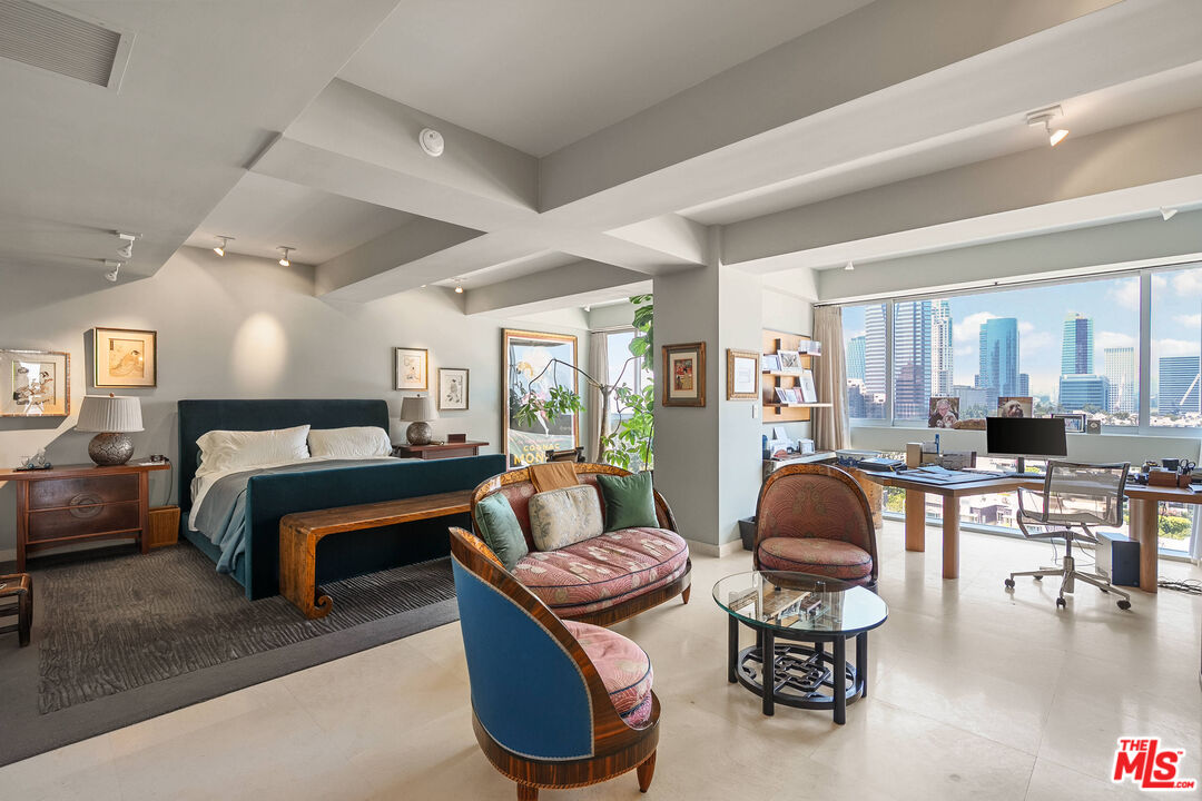 2222 Avenue Of The Stars, Unit 1404 Los Angeles, CA 90067 - Photo 6 of 12 a living room with furniture a rug kitchen view and a large window