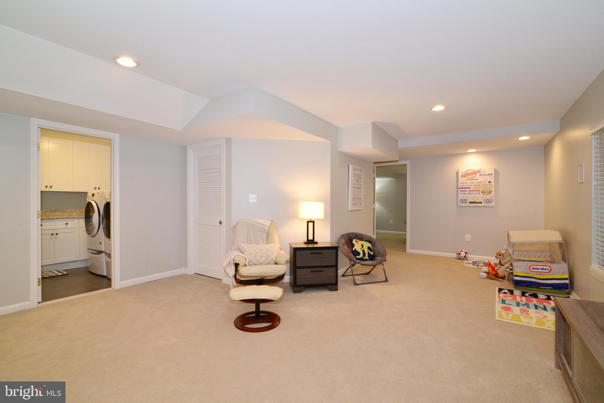 11633 Springhouse Place Reston, VA 20194 - Photo 30 of 42 Recreation Room with View to Laundry and Bedroom.
