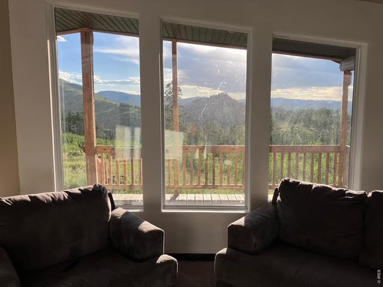 892 Stratton Park Road Bellvue, CO 80512 - Photo 7 of 27 a living room with furniture and a window