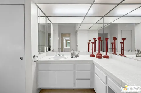 a bathroom with a sink and a mirror