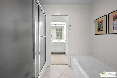 a bathroom with a tub and shower