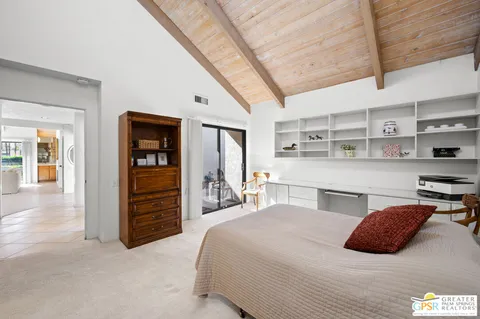 a bedroom with a bed and a cabinets