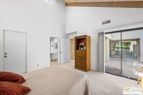 a bedroom with a bed and a walk in closet