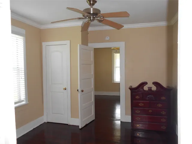 a room with a closet and a window