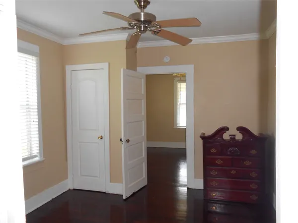 a room with a closet and a window