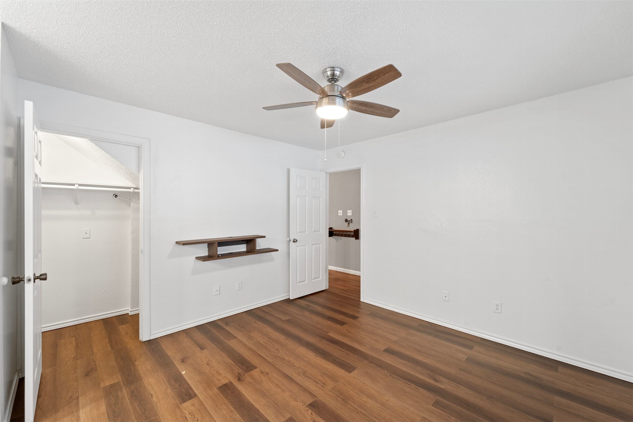 500 Hesters Crossing Road, Unit 209 Round Rock, TX 78681 - Photo 11 of 24 a view of a kitchen with wooden floor and a ceiling fan