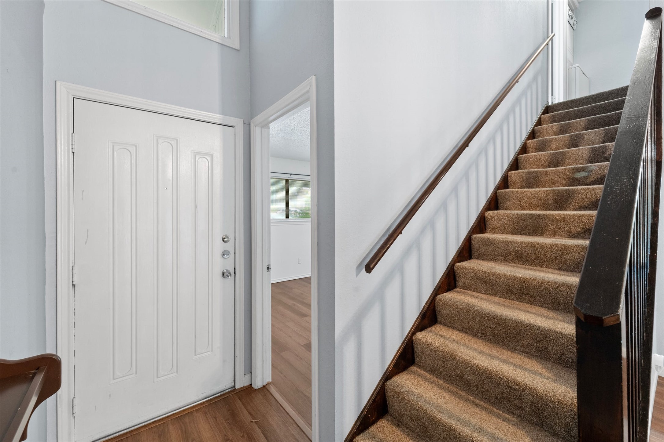 500 Hesters Crossing Road, Unit 209 Round Rock, TX 78681 - Photo 15 of 24 a view of staircase with wooden floor and white walls