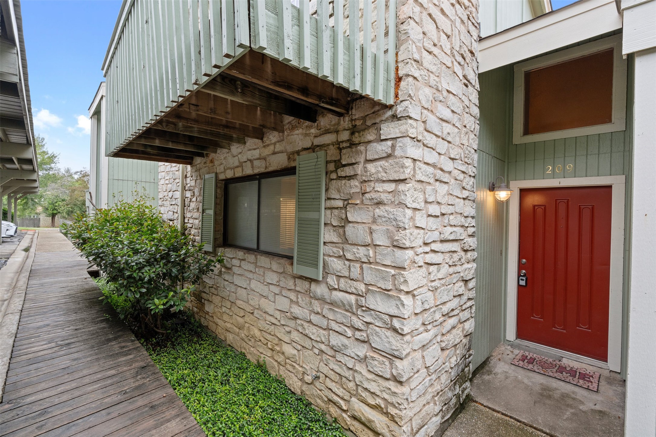 500 Hesters Crossing Road, Unit 209 Round Rock, TX 78681 - Photo 22 of 24 a front view of a house with a yard
