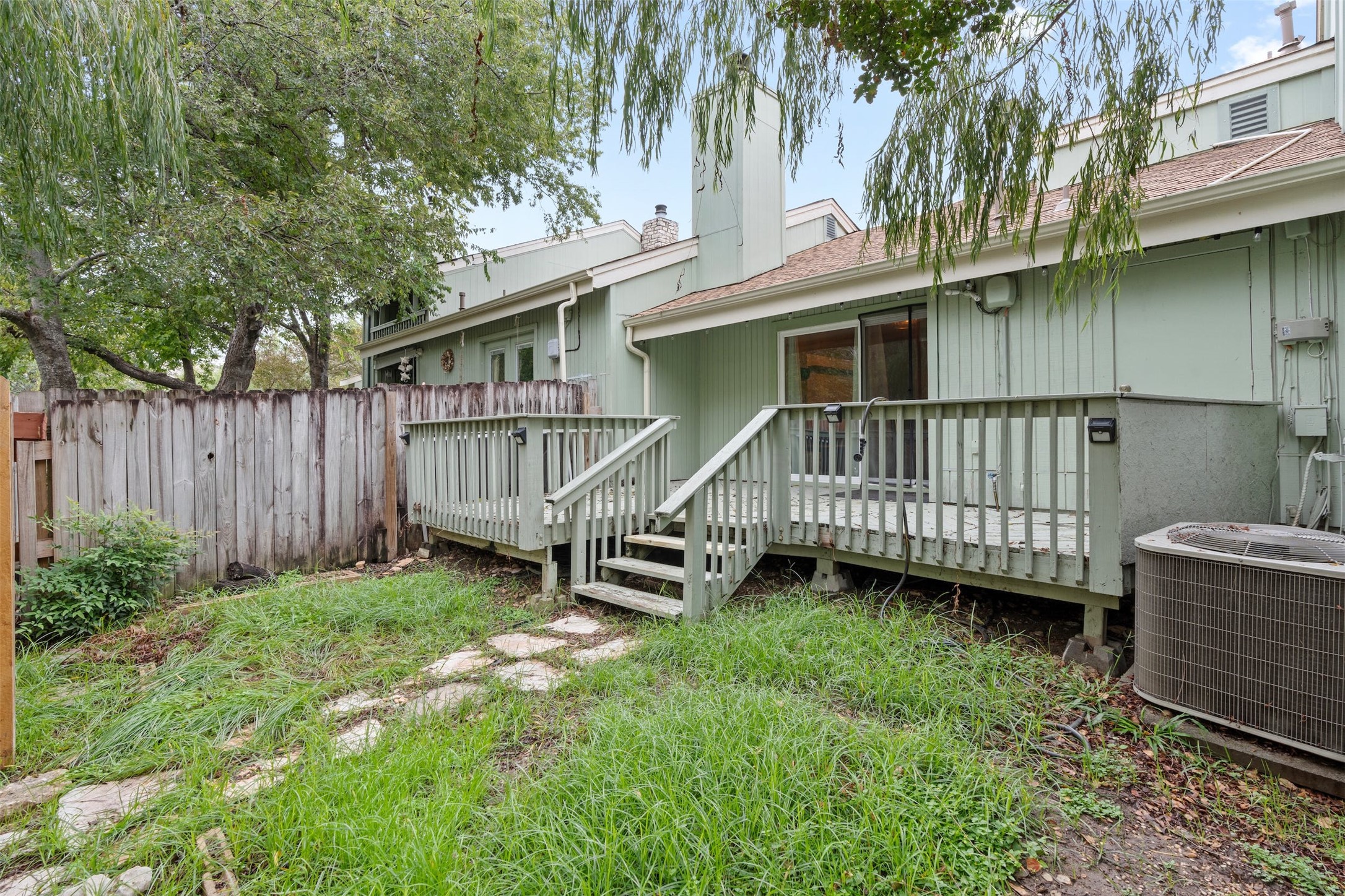 500 Hesters Crossing Road, Unit 209 Round Rock, TX 78681 - Photo 5 of 24 a view of a house with a yard and deck