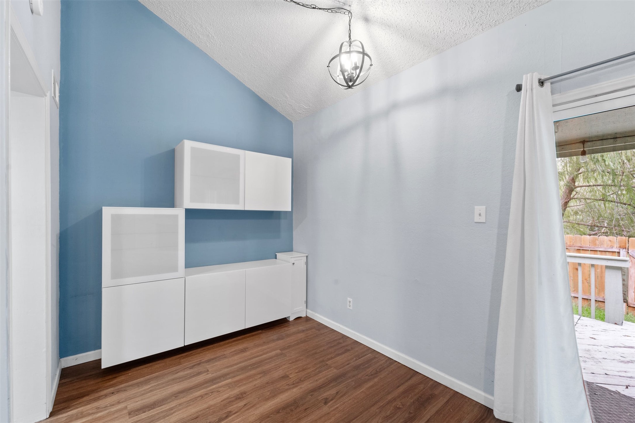 500 Hesters Crossing Road, Unit 209 Round Rock, TX 78681 - Photo 6 of 24 a view of empty room with wooden floor and window