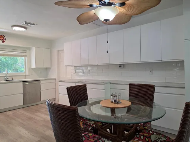 a bathroom with a granite countertop sink mirror and double