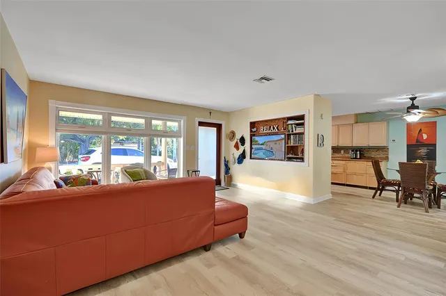 a kitchen with granite countertop a refrigerator and a sink