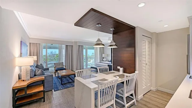 a living room with furniture a rug and a window