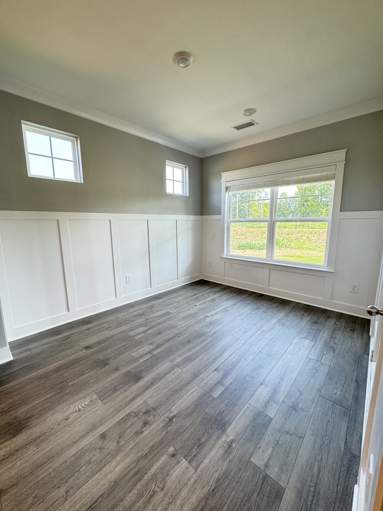 5482 Rooker Road Smyrna, TN 37167 - Photo 12 of 30 a view of an empty room with wooden floor and a window